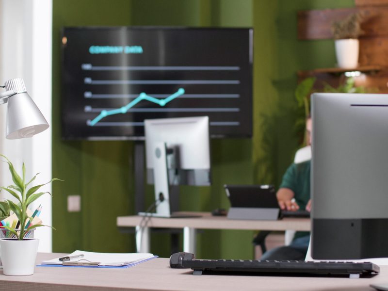 Entrepreneur man worker sitting at desk table in startup business office typing management strategy working at business presentation. Businessman analyzing marketing partnership.